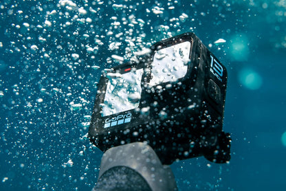 GoPro HERO13 Black Accessory Bundle - Includes The Handler, 2 Enduro Batteries, 2 Curved Adhesive Mounts, 64GB SanDisk MicroSD Card, and Carrying Case